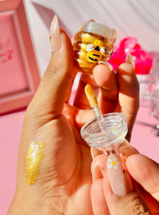 Besitos de miel lip gloss (brillo dorado con aroma a miel)